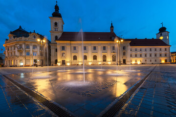 Fototapeta na wymiar Large Square with City Hall and Church in Sibiu Hermannstadt, Romania