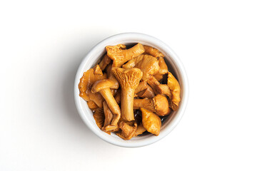Fermented food. Canned mushrooms in a bowl on a white background.