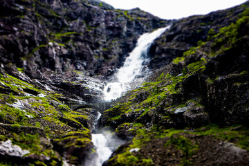 Obraz premium Bridge over a waterfall on Trollstigen road in Romsdal, Norway. 