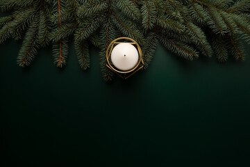 There is a candle on the Christmas table.