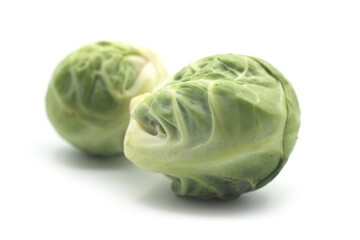 Closeup of organic brussels sprouts on white background