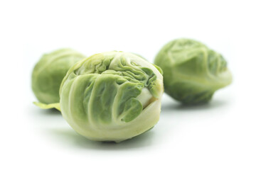 Fototapeta premium Closeup of organic brussels sprouts on white background