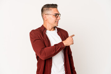 Young caucasian handsome man isolated looks aside smiling, cheerful and pleasant.