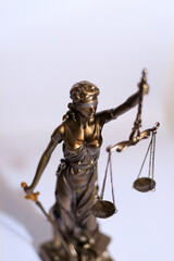 Close-up of a justice figure shines from sunlight