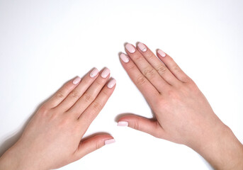 Female manicure on a white background. Simple