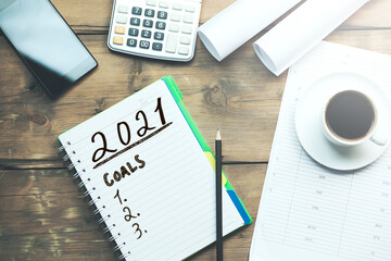 2021 goals on notepad and finance concept