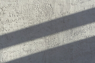Fototapeta premium Shadows on the gray concrete wall from the sun. Shadow background..