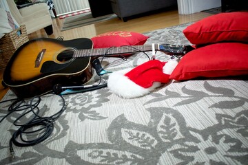 Guitar on the floor in Christmas time