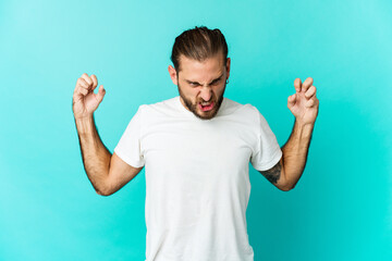 Young man with long hair look screaming with rage.