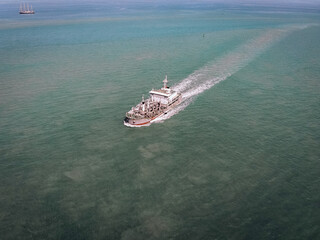 Top view of cruise ship with full passengers in the middle of the sea