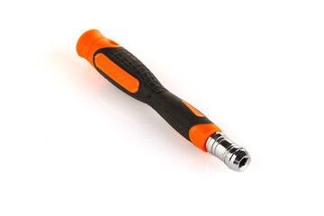 Screwdriver handle with replaceable bits. Orange plastic handle covered with rubber. Isolated on white background. Close-up. Full depth of field.