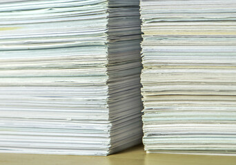 bundles bales of paper documents. stacks packs pile on the desk in the office