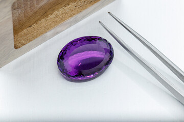 macro mineral faceted stone cut Amethysts on a gray background