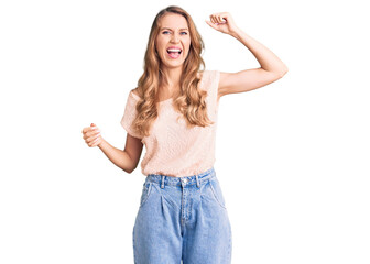 Young beautiful caucasian woman with blond hair wearing casual clothes angry and mad raising fist frustrated and furious while shouting with anger. rage and aggressive concept.