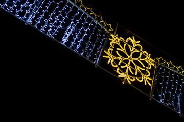 Obraz premium Night close-ups on the lights of Christmas street decorations