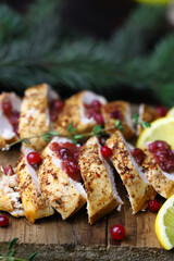 Turkey fillet with cranberry sauce. Festive food. Christmas mood.