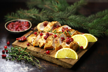 Turkey fillet with cranberry sauce. Festive food. Christmas mood.