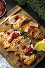 Turkey fillet with cranberry sauce. Festive food. Christmas mood.