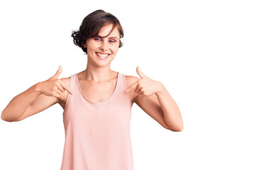 Beautiful young woman with short hair wearing casual style with sleeveless shirt looking confident...