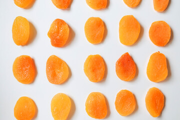 Dry apricots placed on a white board. Place for text 