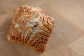 Fresh baked apple turnover on wood