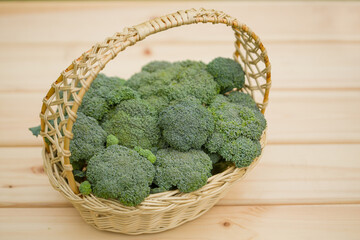 Broccoli in a basket. Green harvest of fresh vegetables.