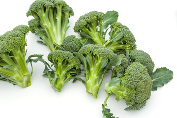 Broccoli on a white background. Green harvest of fresh vegetables. Healthy vegetarian food