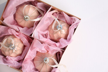 Beautiful Christmas baubles in box on white background, top view
