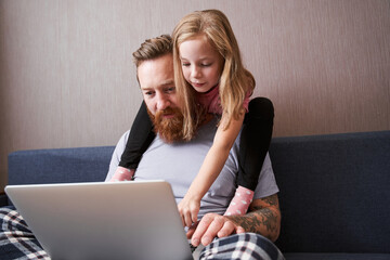 Father in pajama and his cute little daughter