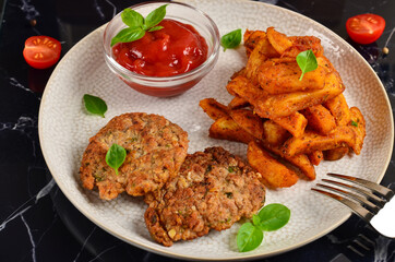 Spicy potato slices with spices garam masala and beef kebab with ketchup and basil.