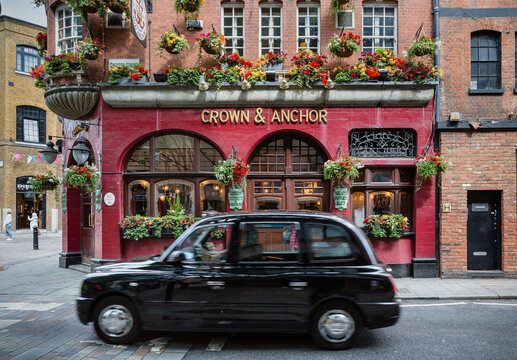London, UK: Crown & Anchor pub with a black cab