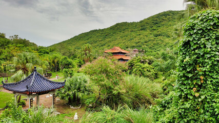 View of the pagoda, pavilion and palm tops. Nanshan Cultural Tourism Zone. Sanya. Hainan Island. China. Asia	