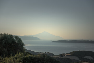 Holy Mount Athos from a distance in summer haze 