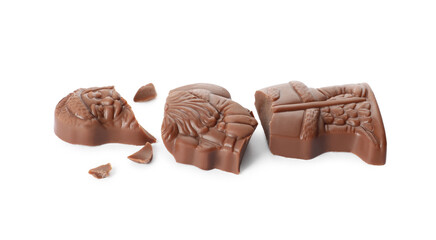 Pieces of chocolate Santa Claus candy on white background