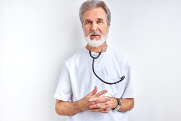 confident professional bearded man pharmacy expert with stethoscope, isolated on light white color background