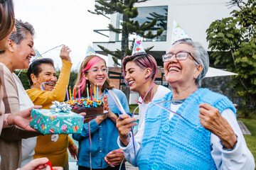 Multi Generation latin women Family Celebrating a happy Birthday in Latin America