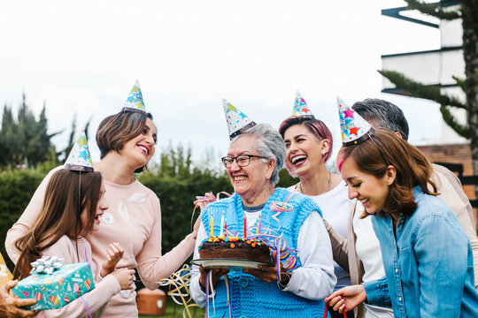 Latin Grandmother And Women Family Celebrating A Happy Birthday In Mexico