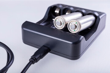 Black battery charger. Accessories for storing energy.