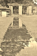 water path to structure in cemetery black and white