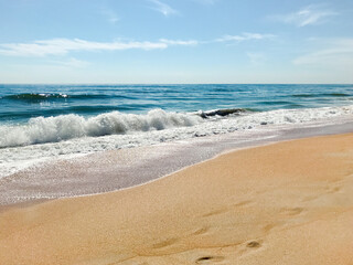 Fototapeta na wymiar Incoming waves on the beach