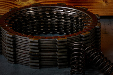 Motorcycle clutch. Close up of the springs and plates on a work bench