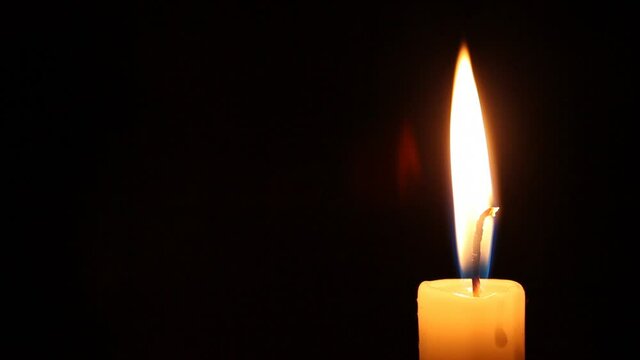burning candle dies out - isolated on black background HD video 1920x1080. mourning or memory symbol