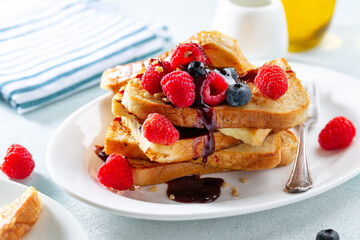 French toasts with fruits served on plate