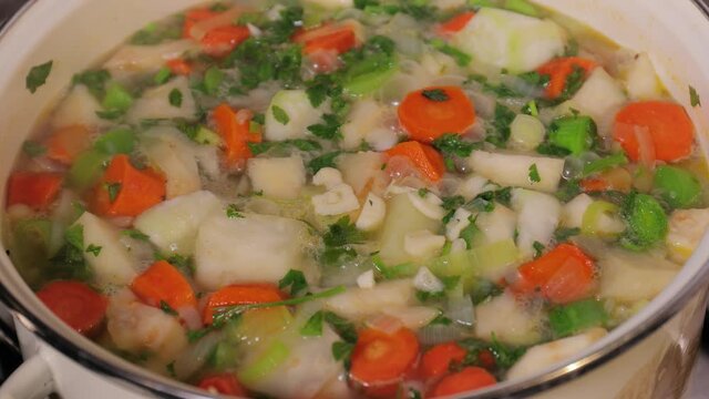 Cooking vegetable soup with many frash ingredients