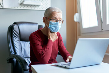 Elderly lady having a video call with her family