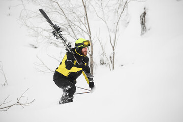 Skier walks in the mountains