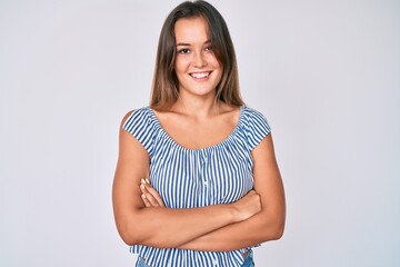 Obraz premium Beautiful caucasian woman wearing casual striped shirt happy face smiling with crossed arms looking at the camera. positive person.