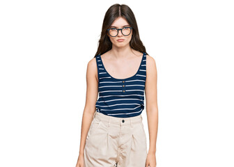 Fototapeta premium Young beautiful caucasian girl wearing casual clothes and glasses skeptic and nervous, frowning upset because of problem. negative person.