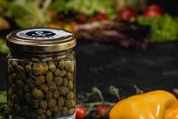 macro close-up of pickled green capers on white base