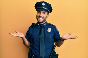 Handsome hispanic man wearing police uniform smiling showing both hands open palms, presenting and advertising comparison and balance